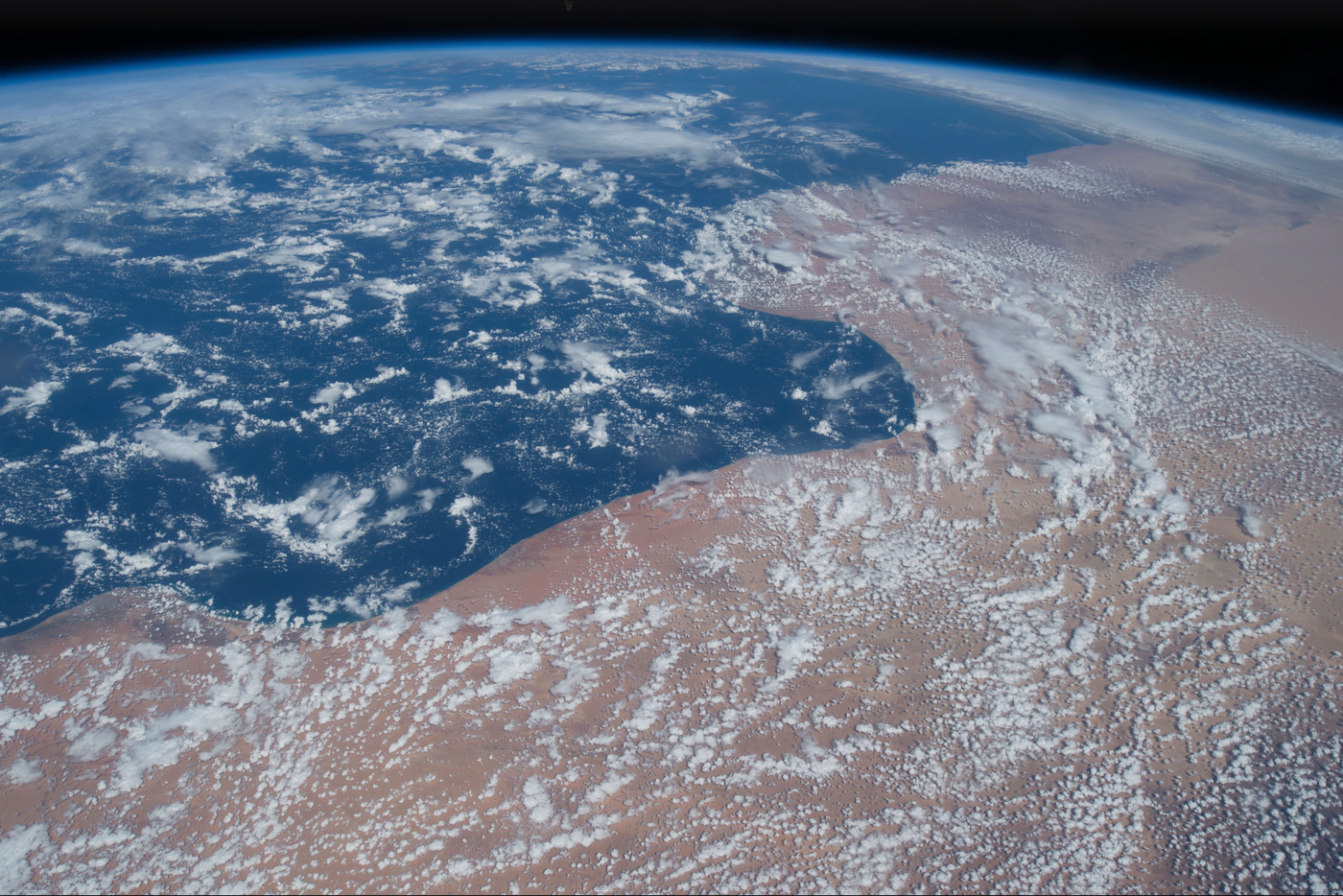 An Earth-from-orbit photograph filling Shrike’s full-screen view with controls hidden.